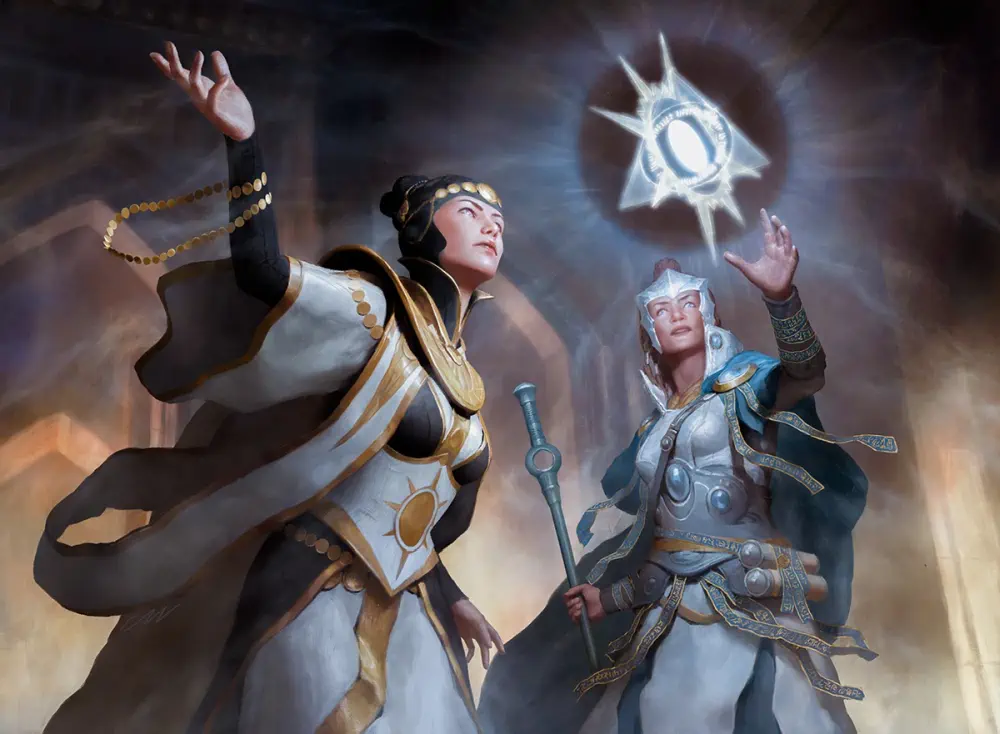 A woman in a white tabard, blue robes, and blue cape has blue and gold strips fluttering down from her belt and pauldrons. Holding a staff in her right hand, she reaches out with the other to a magic glowing symbol floating in the air before her. Another woman wearing black, white, and gold robes stands nearbya and sweeps widely with one arm as if helping to create it.