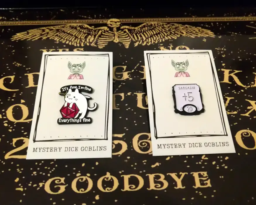 Two enamel pins